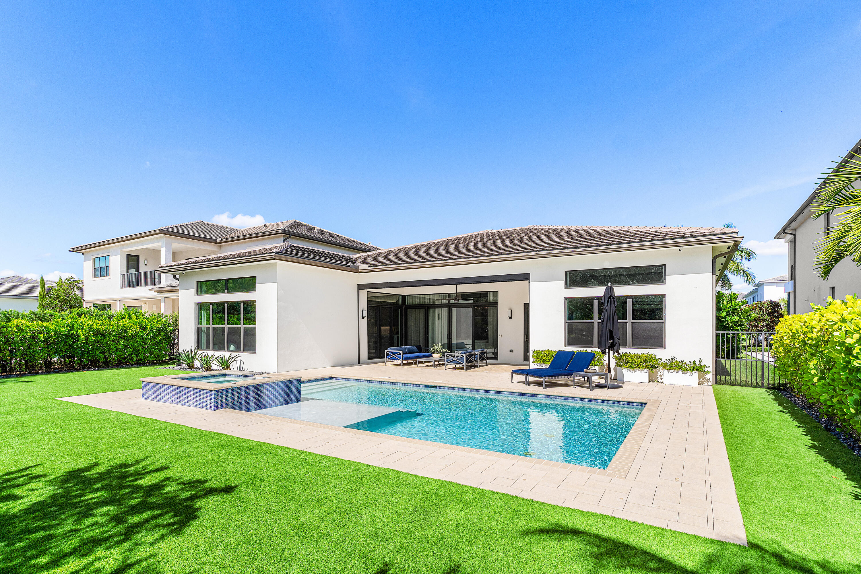 9594 Vescovato Way Boca Raton, FL 33496 - Photo 34 of 67 a view of a house with a backyard porch and sitting area