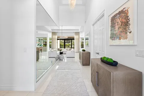 a bedroom with furniture and a large window