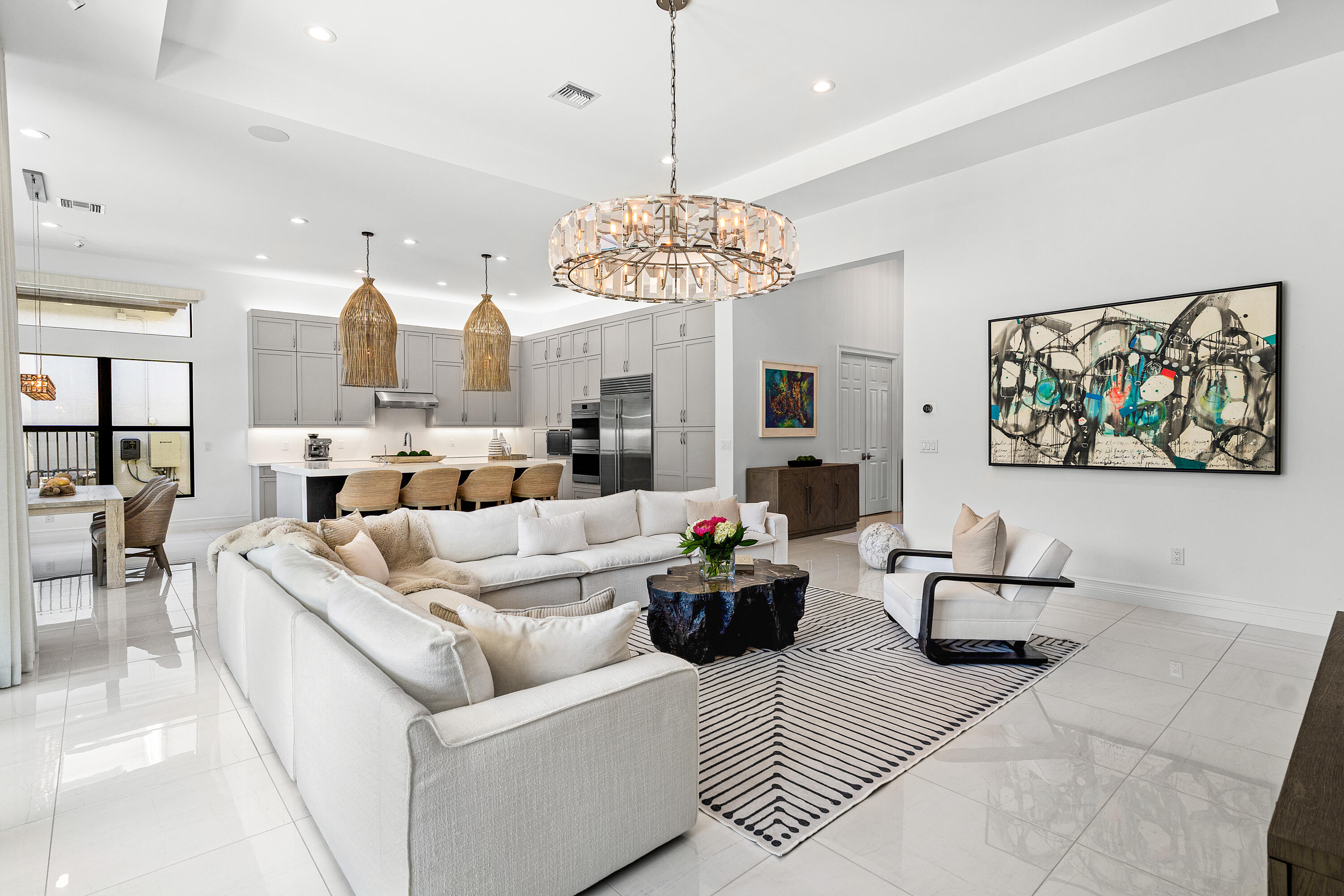 9594 Vescovato Way Boca Raton, FL 33496 - Photo 9 of 67 a living room with furniture and a chandelier