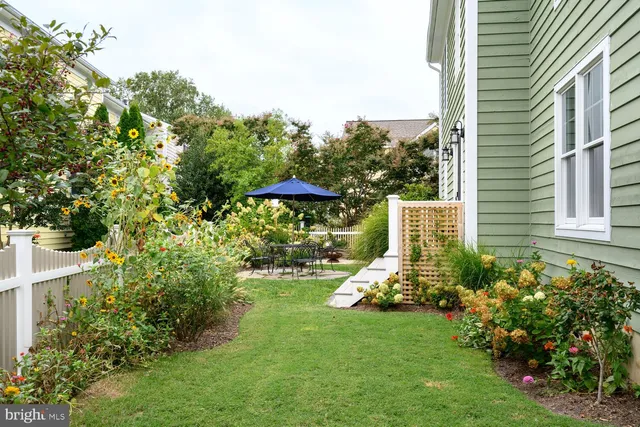 a view of a chair and table under an umbrella