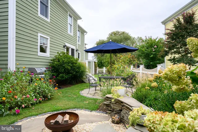 a view of a table and chairs under an umbrella