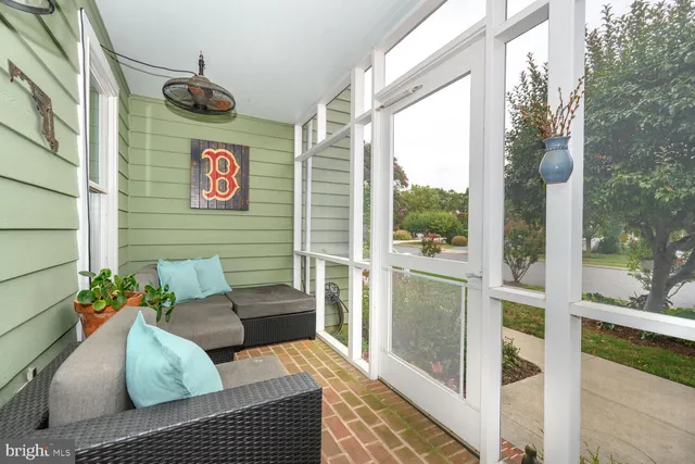 a balcony with furniture and flowers