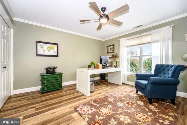 a living room with a kitchen island furniture and a fireplace