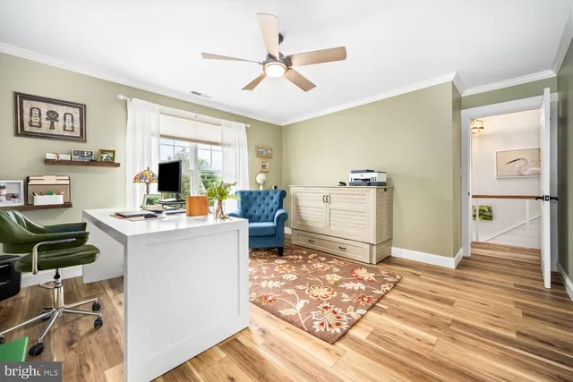 a bathroom with a sink a mirror a vanity and a shower