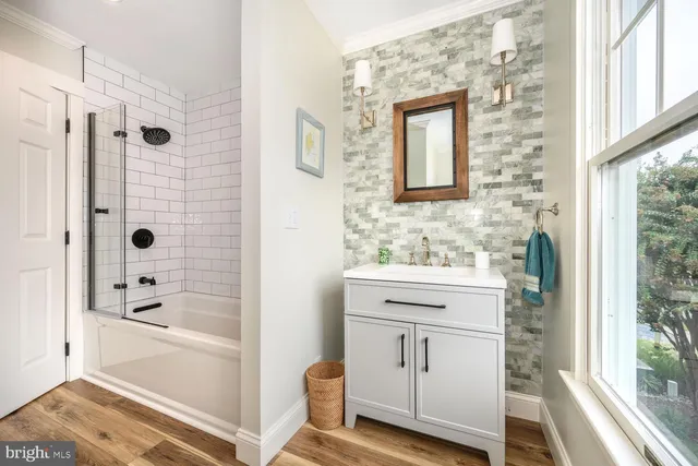 a bedroom with two beds and a chandelier