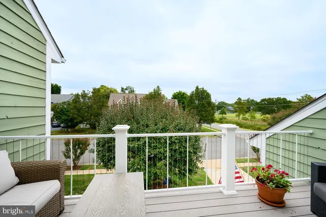 a view of walk in closet with clothes