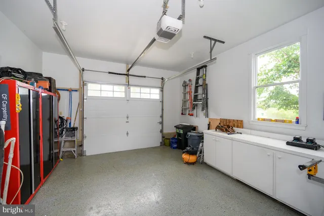 a view of a lake with boats and trees in the background