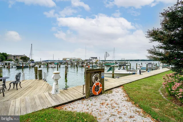 a view of a lake with outdoor seating