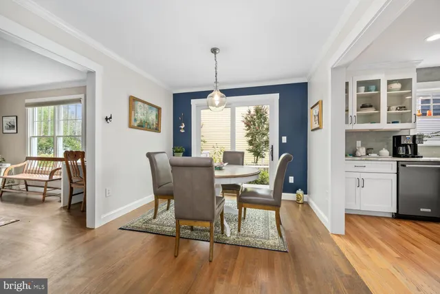 a dining room with furniture window wooden floor