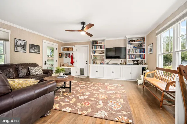 a living room with furniture fireplace and a flat screen tv