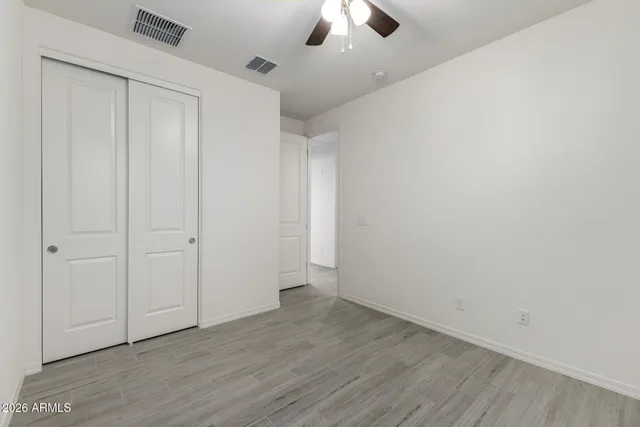 a kitchen with a sink a stove and cabinets