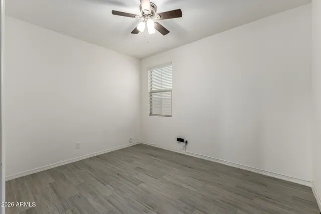 a kitchen with stainless steel appliances granite countertop a stove a microwave and a sink