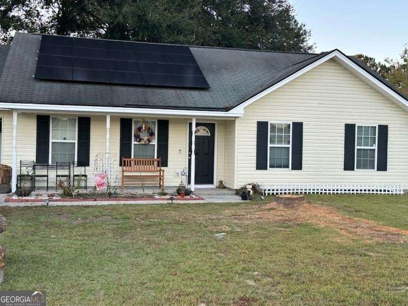 110 Reese Way Rincon, GA 31326 - Photo 1 of 1 a front view of a house with a garden
