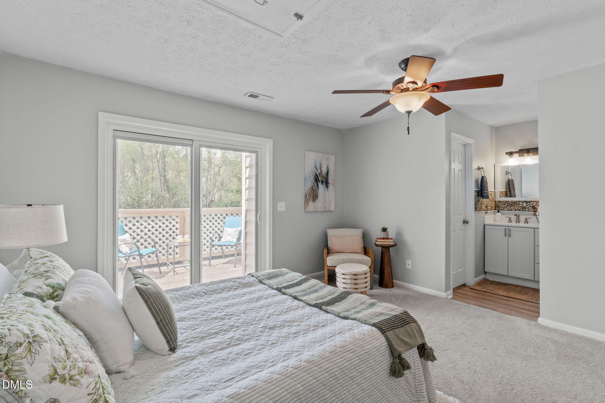 203 Oak Hollow Court Raleigh, NC 27613 - Photo 26 of 37 a bedroom with a large bed and a window