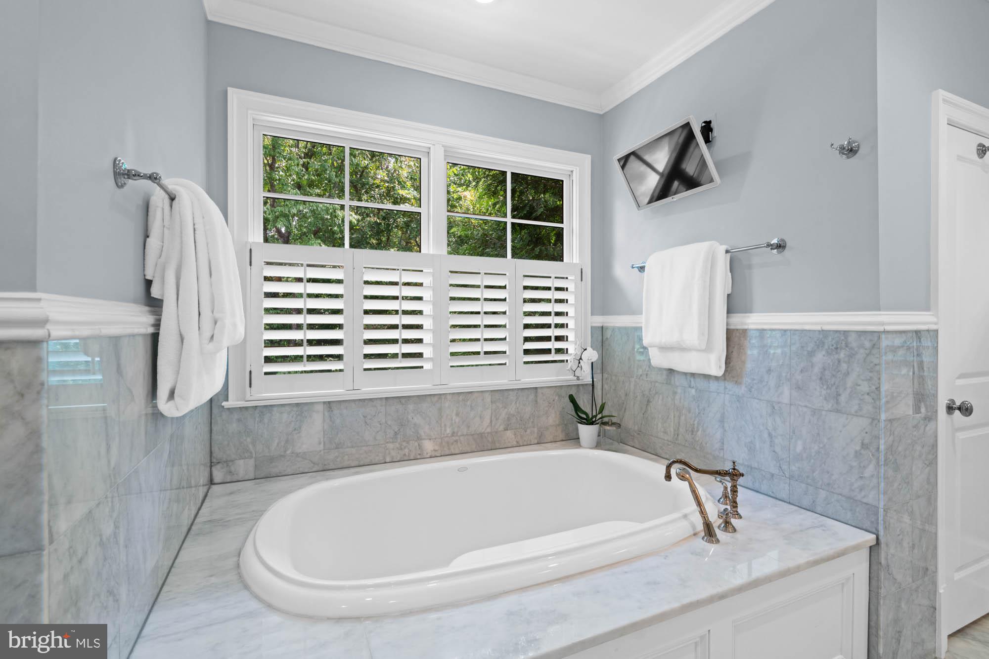 2215 King Place Northwest Washington, DC 20007 - Photo 27 of 58 a bath tub sitting next to a window