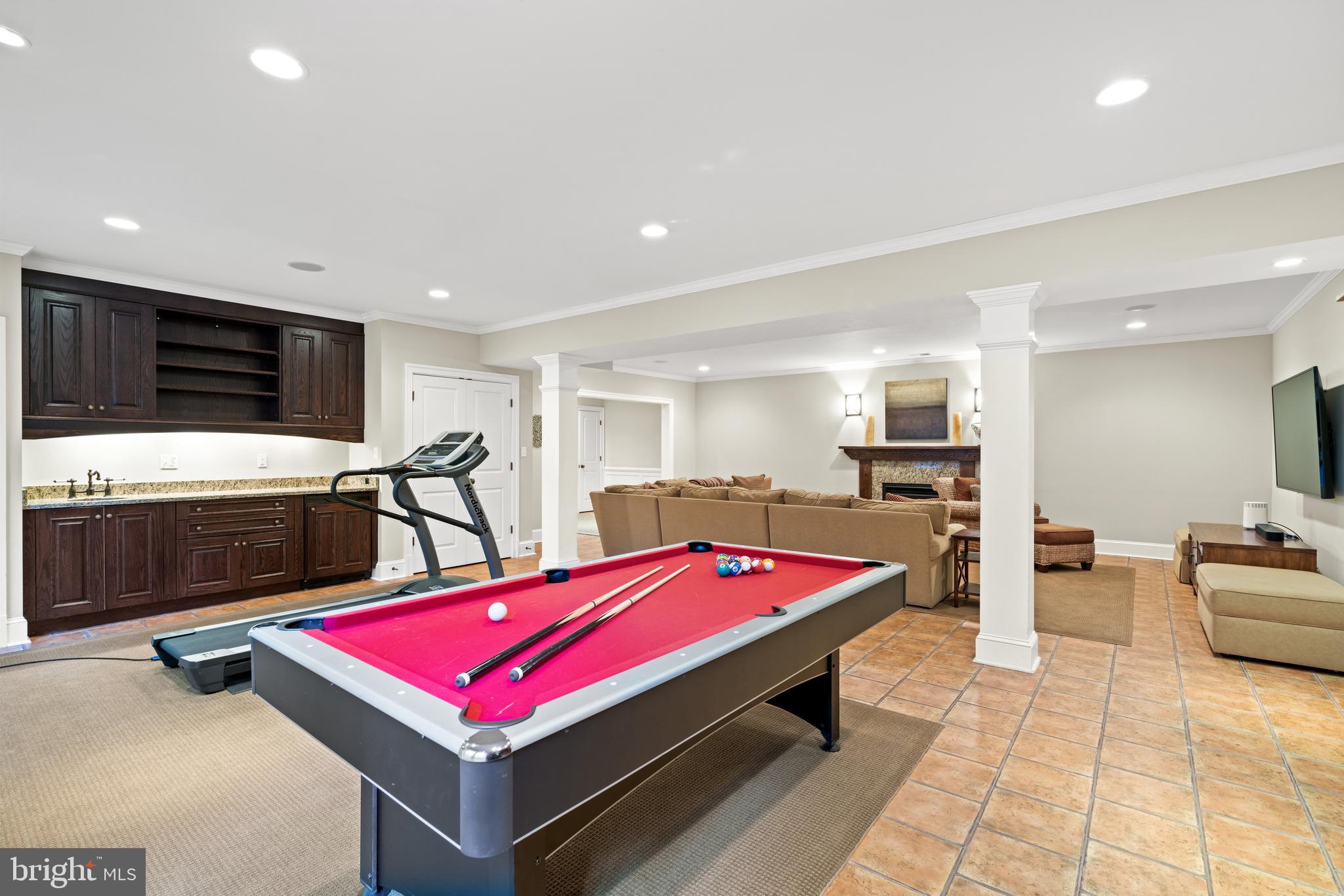 2215 King Place Northwest Washington, DC 20007 - Photo 46 of 58 a room with pool table flat screen tv and windows