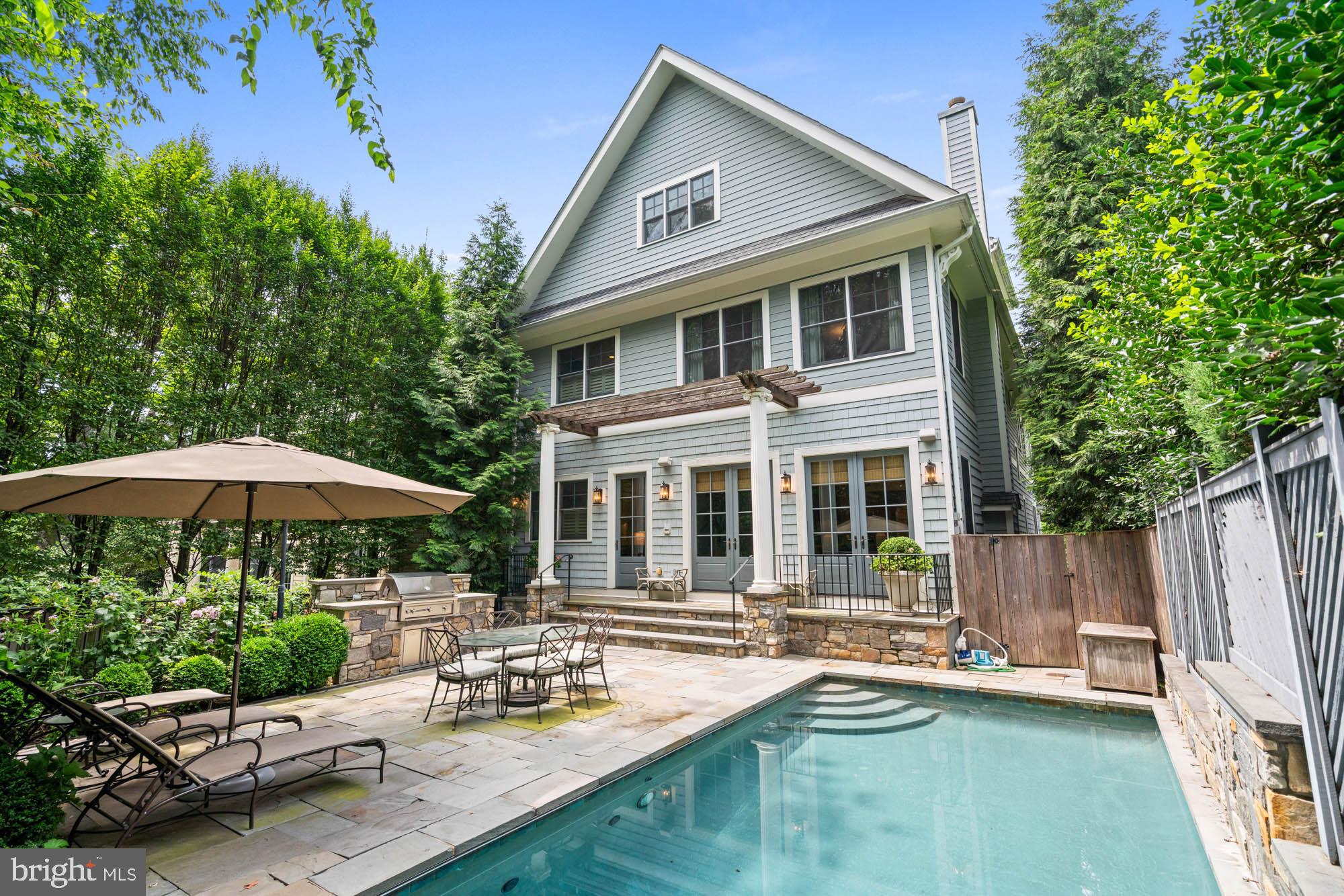 2215 King Place Northwest Washington, DC 20007 - Photo 56 of 58 a view of a house with backyard sitting area and swimming pool