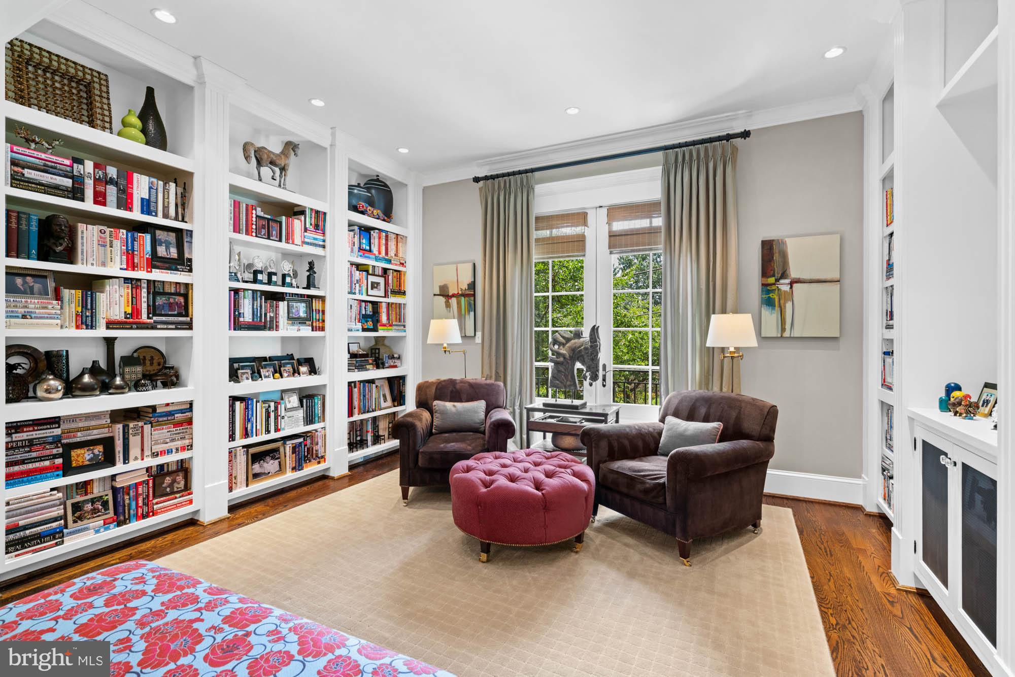 2215 King Place Northwest Washington, DC 20007 - Photo 9 of 58 a living room with furniture and a book shelf
