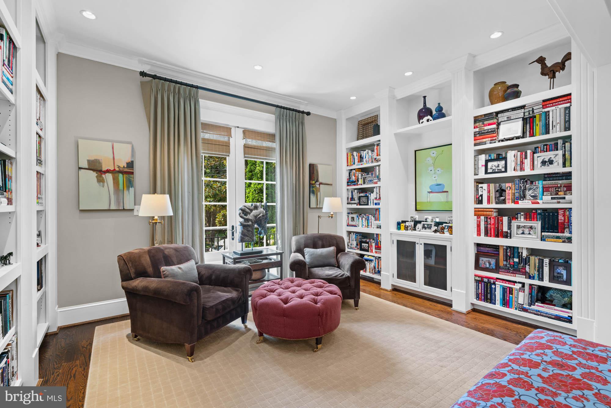2215 King Place Northwest Washington, DC 20007 - Photo 10 of 58 a living room with furniture and a book shelf