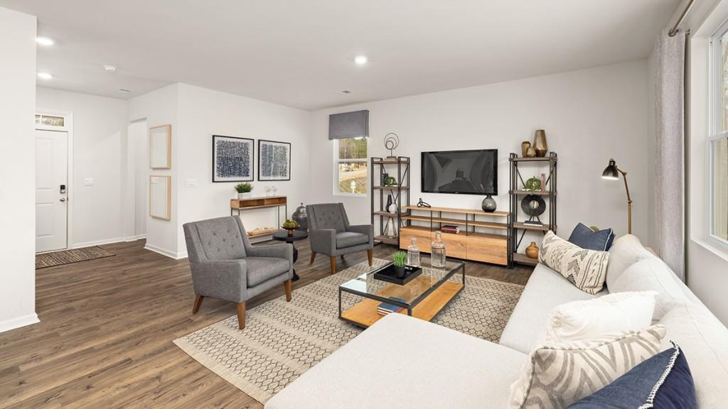 3873 Donetta Drive Atlanta, GA 30349 - Photo 14 of 50 a living room with furniture and a flat screen tv