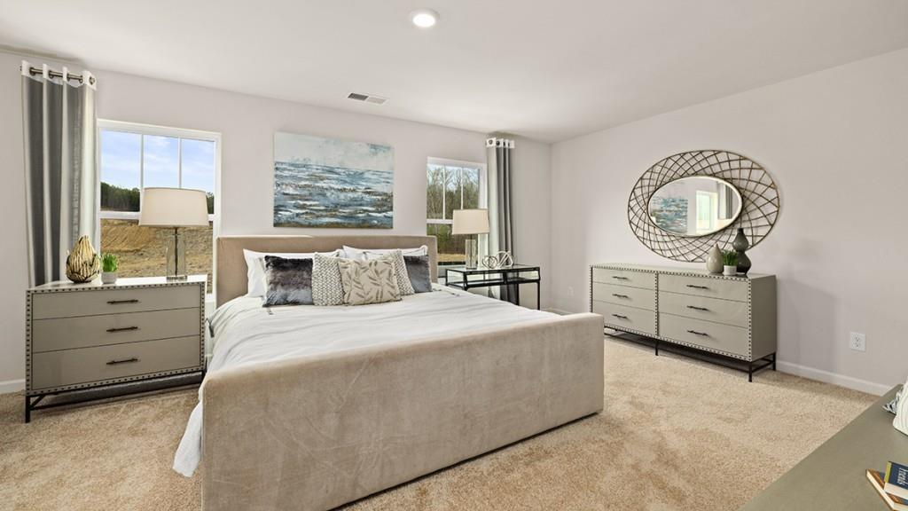 3873 Donetta Drive Atlanta, GA 30349 - Photo 15 of 50 a spacious bedroom with a bed and a dresser