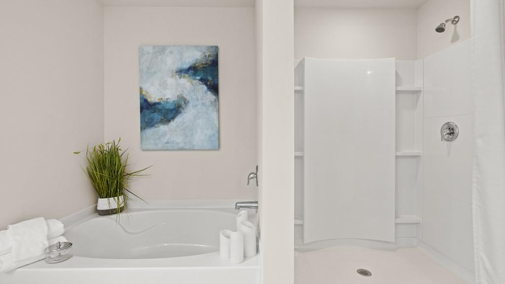 3873 Donetta Drive Atlanta, GA 30349 - Photo 23 of 50 a white bath tub with a shower