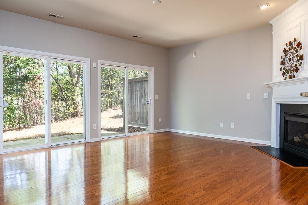 8722 Owl Roost Place Raleigh, NC 27617 - Photo 8 of 26 Refreshed hardwoods gleam through the living and dining rooms from the front to the back doors! Living Room