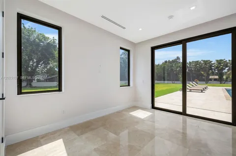 a view of an empty room with a large window