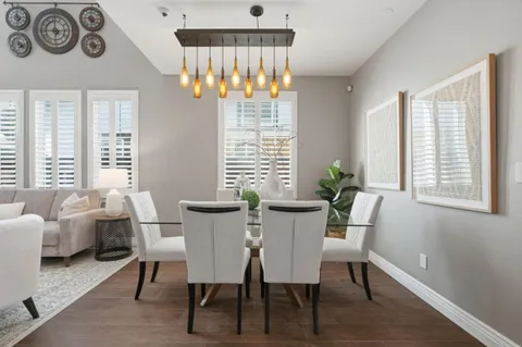 a view of a dining room with furniture window and outside view