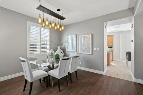 a view of a dining room with furniture and window