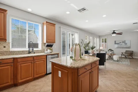 a kitchen with center island and windows
