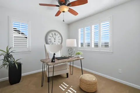 a view of a workspace with a window and a chandelier