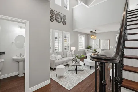 a living room with furniture and a table
