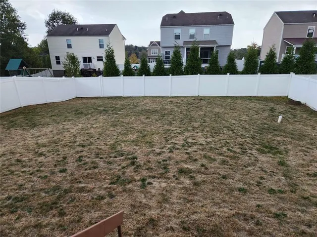 a view of building with tall trees