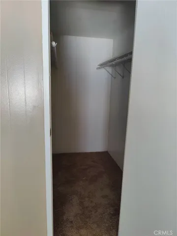 a view of hallway with closet