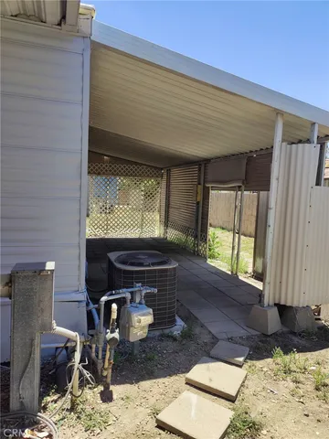 a living room with fireplace furniture and a window