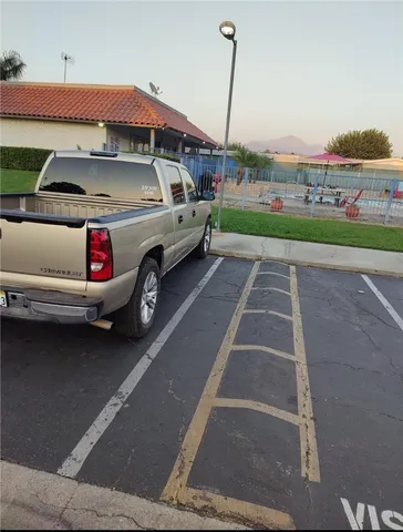 a view of a car park in front of the house