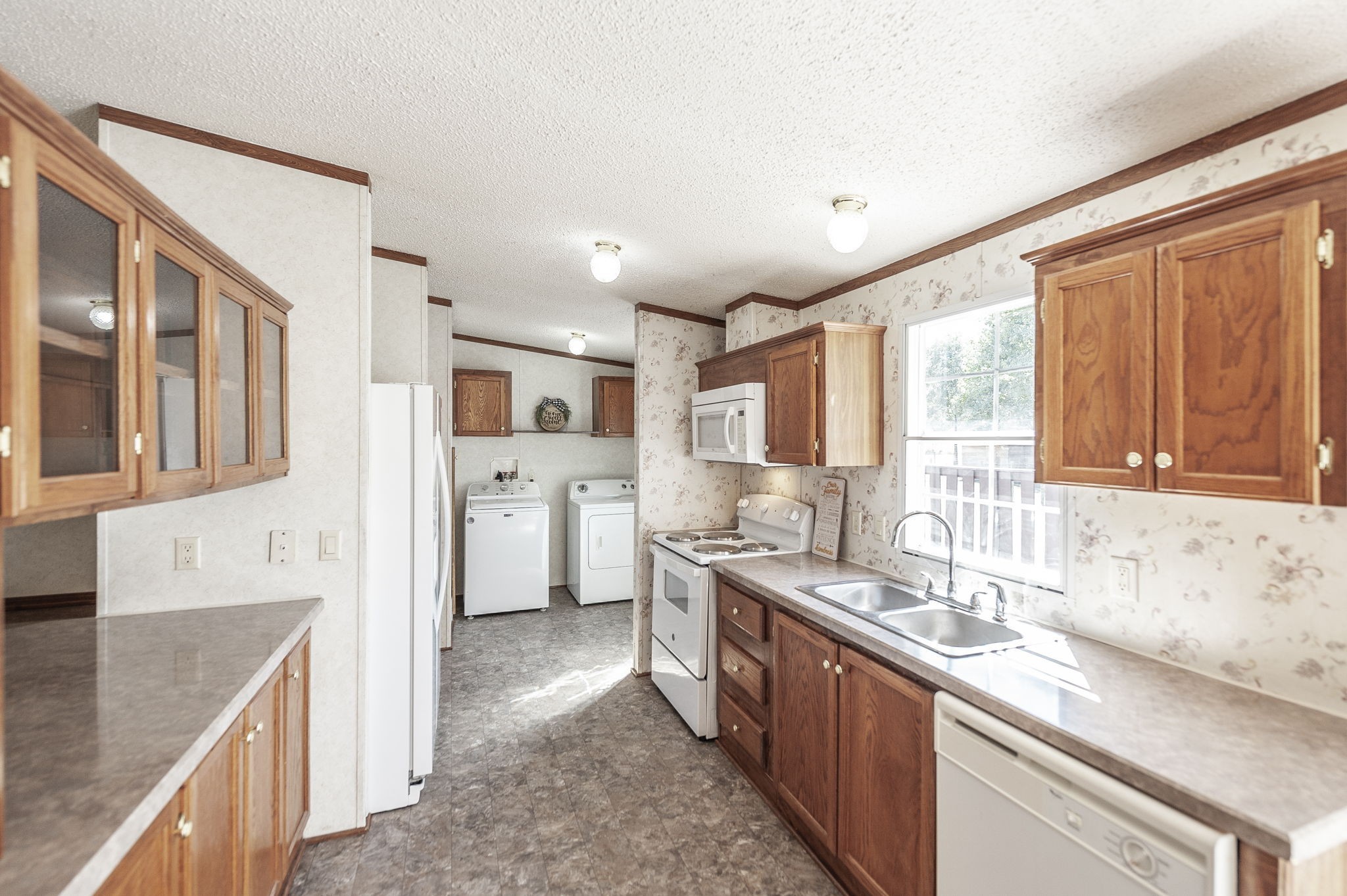 136 East Biggs Road Portland, TN 37148 - Photo 17 of 47 a large kitchen with stainless steel appliances granite countertop a lot of counter space and a sink