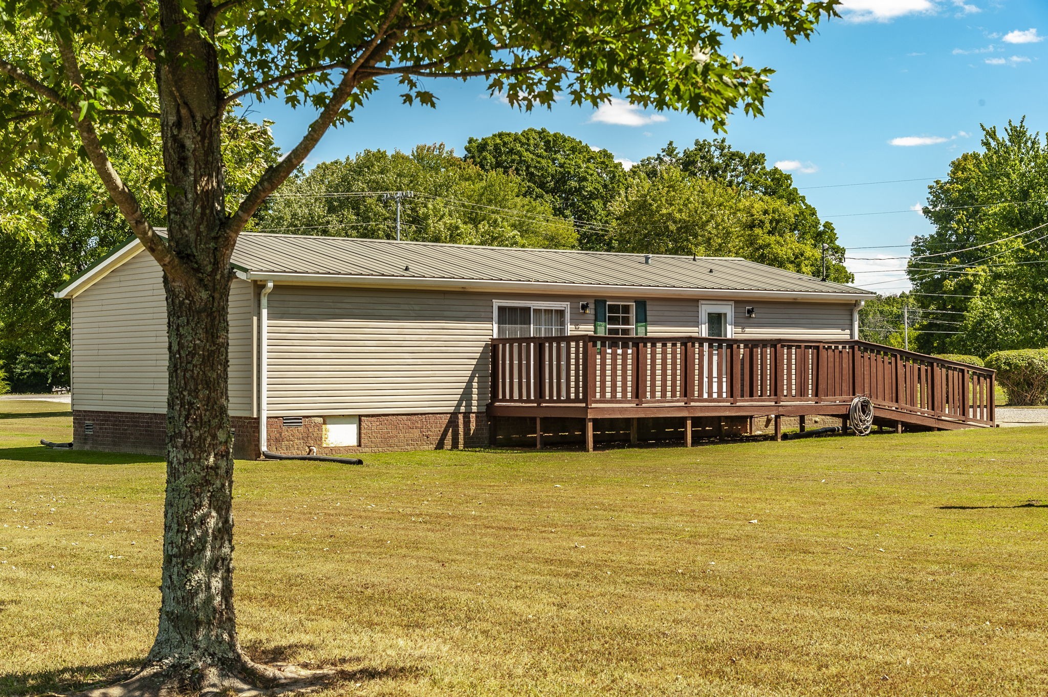 136 East Biggs Road Portland, TN 37148 - Photo 47 of 47 a swimming pool with lawn chairs and wooden fence