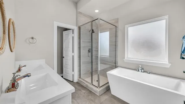 a bathroom with a bathtub and a sink