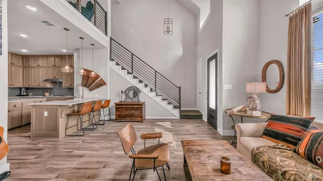 a living room with fireplace furniture and a wooden floor