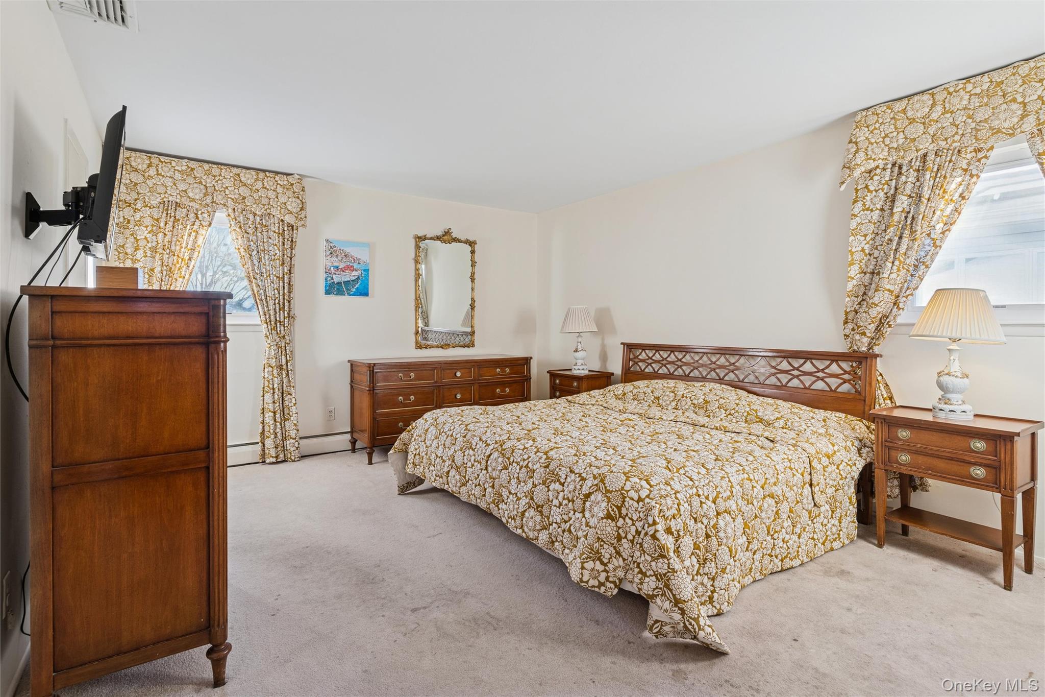 1864 Cynthia Lane Merrick, NY 11566 - Photo 12 of 33 a bed sitting in a bedroom next to a window