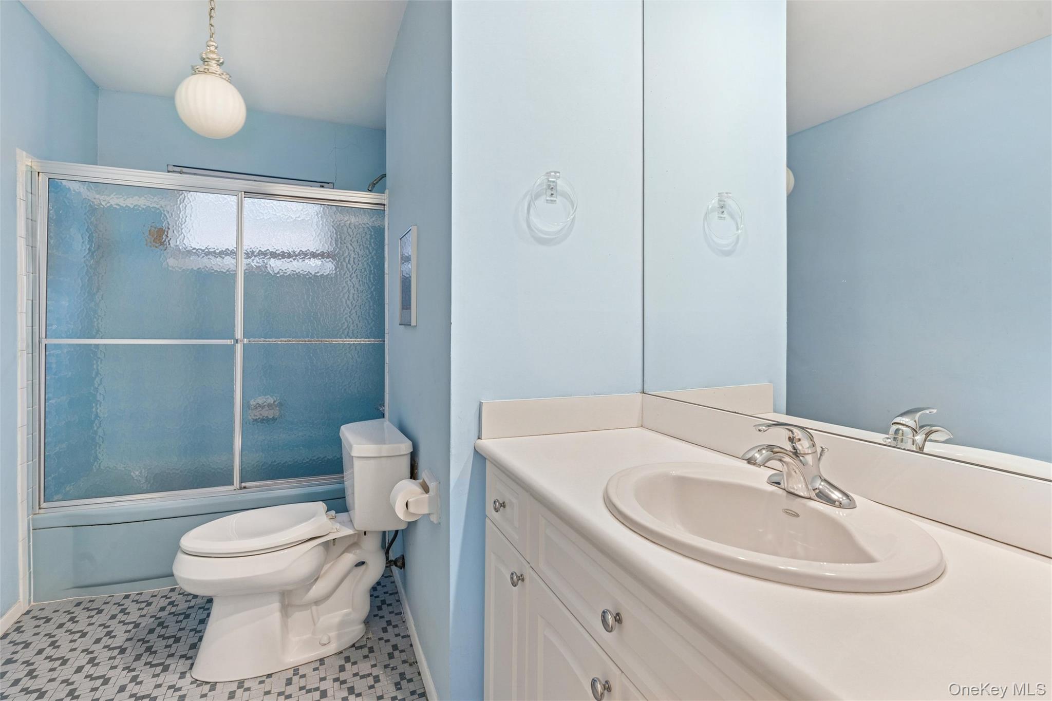 1864 Cynthia Lane Merrick, NY 11566 - Photo 19 of 33 a bathroom with a sink toilet and shower