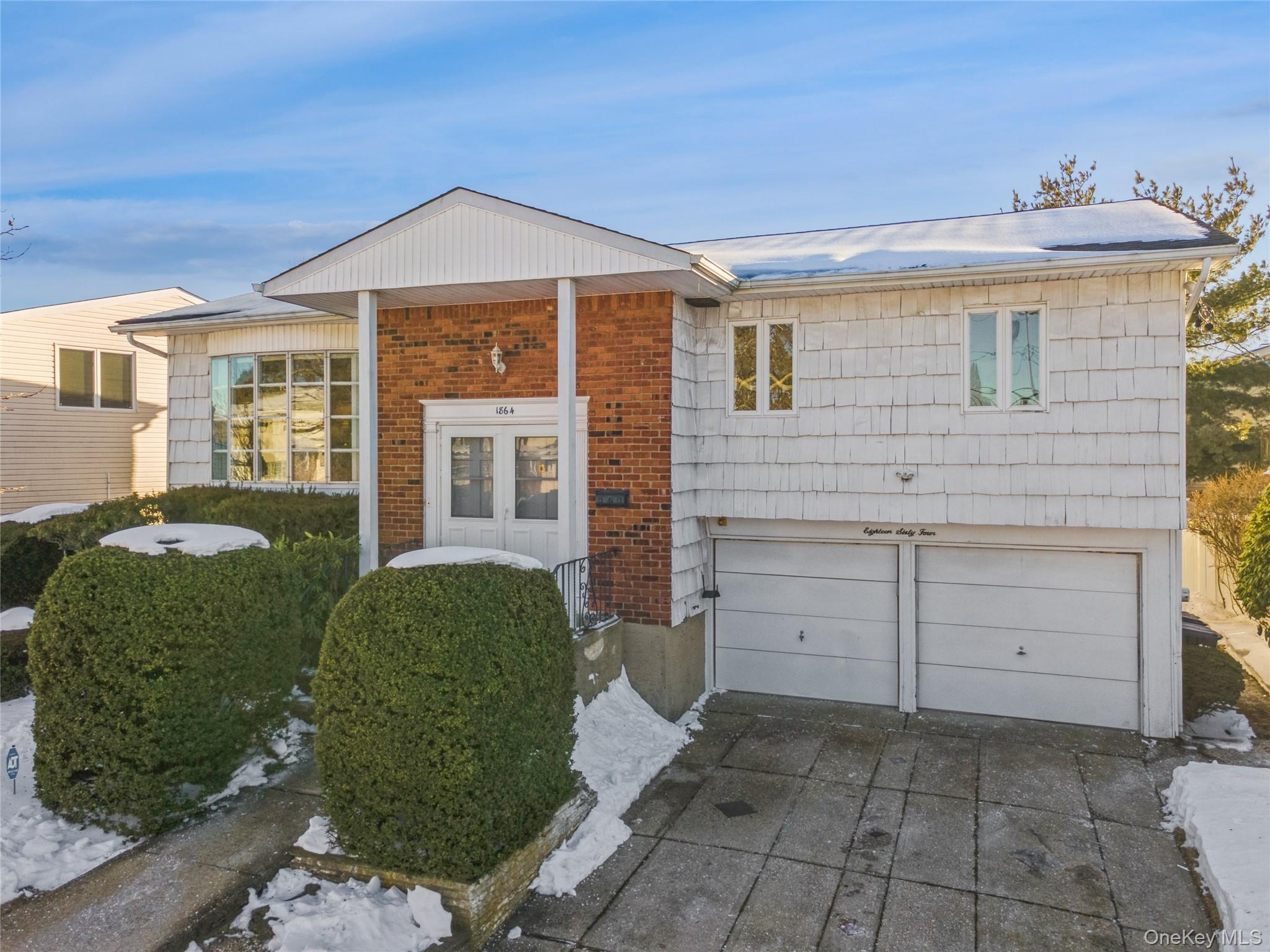 1864 Cynthia Lane Merrick, NY 11566 - Photo 2 of 33 a front view of a house with a yard