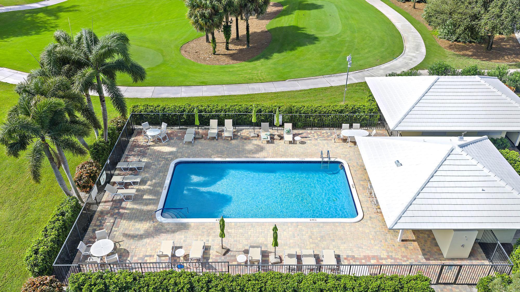 3693 Quail Ridge Drive, Unit BOBWHITE B Boynton Beach, FL 33436 - Photo 23 of 39 a view of outdoor space yard and patio