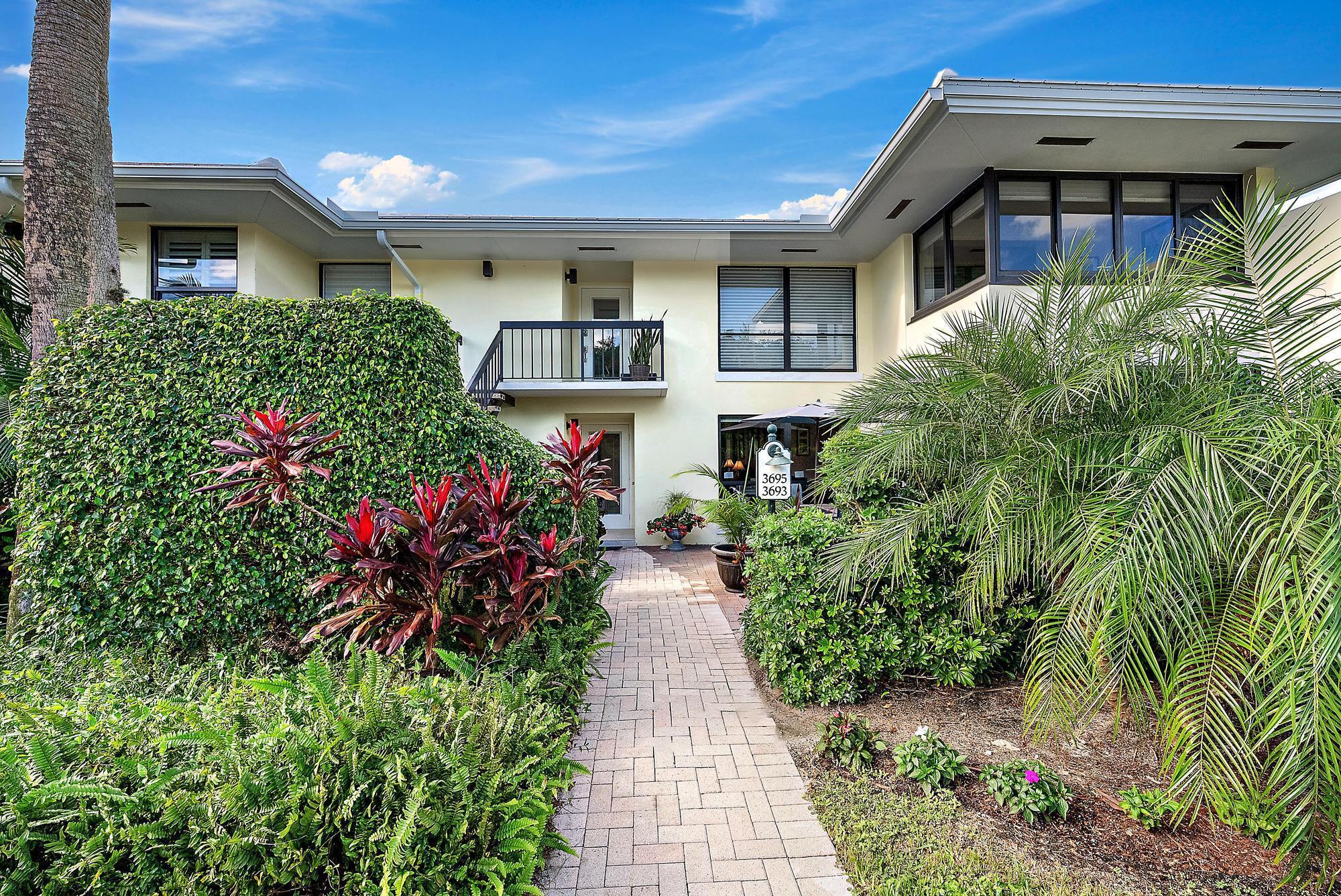 3693 Quail Ridge Drive, Unit BOBWHITE B Boynton Beach, FL 33436 - Photo 26 of 39 a front view of a house with a yard
