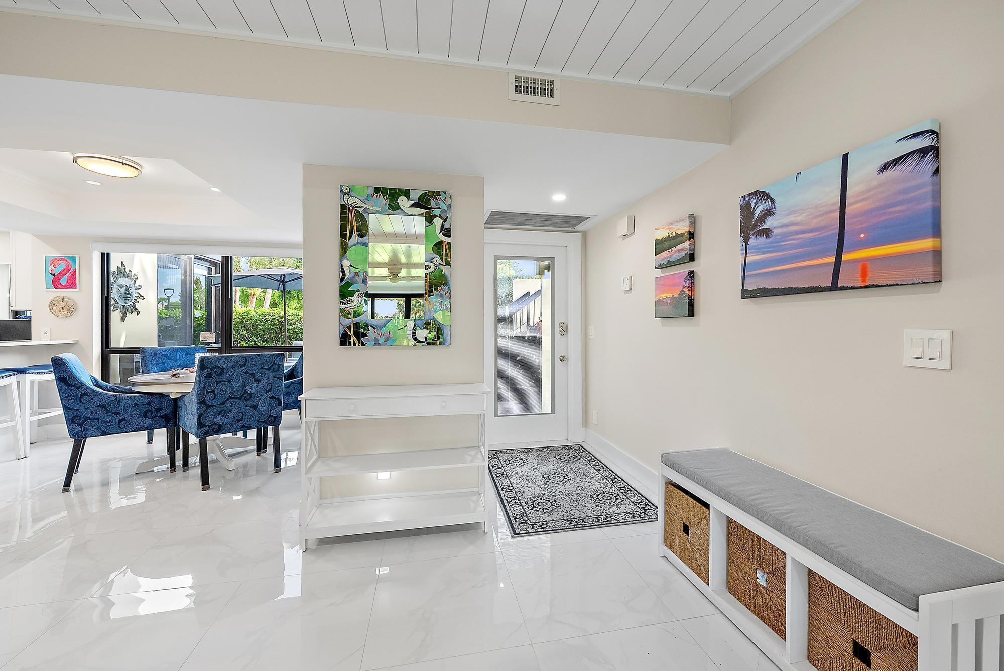 3693 Quail Ridge Drive, Unit BOBWHITE B Boynton Beach, FL 33436 - Photo 6 of 39 a living room with furniture and a rug