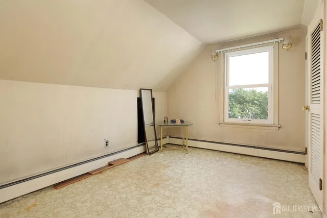 a view of a house with wooden fence and a stairs