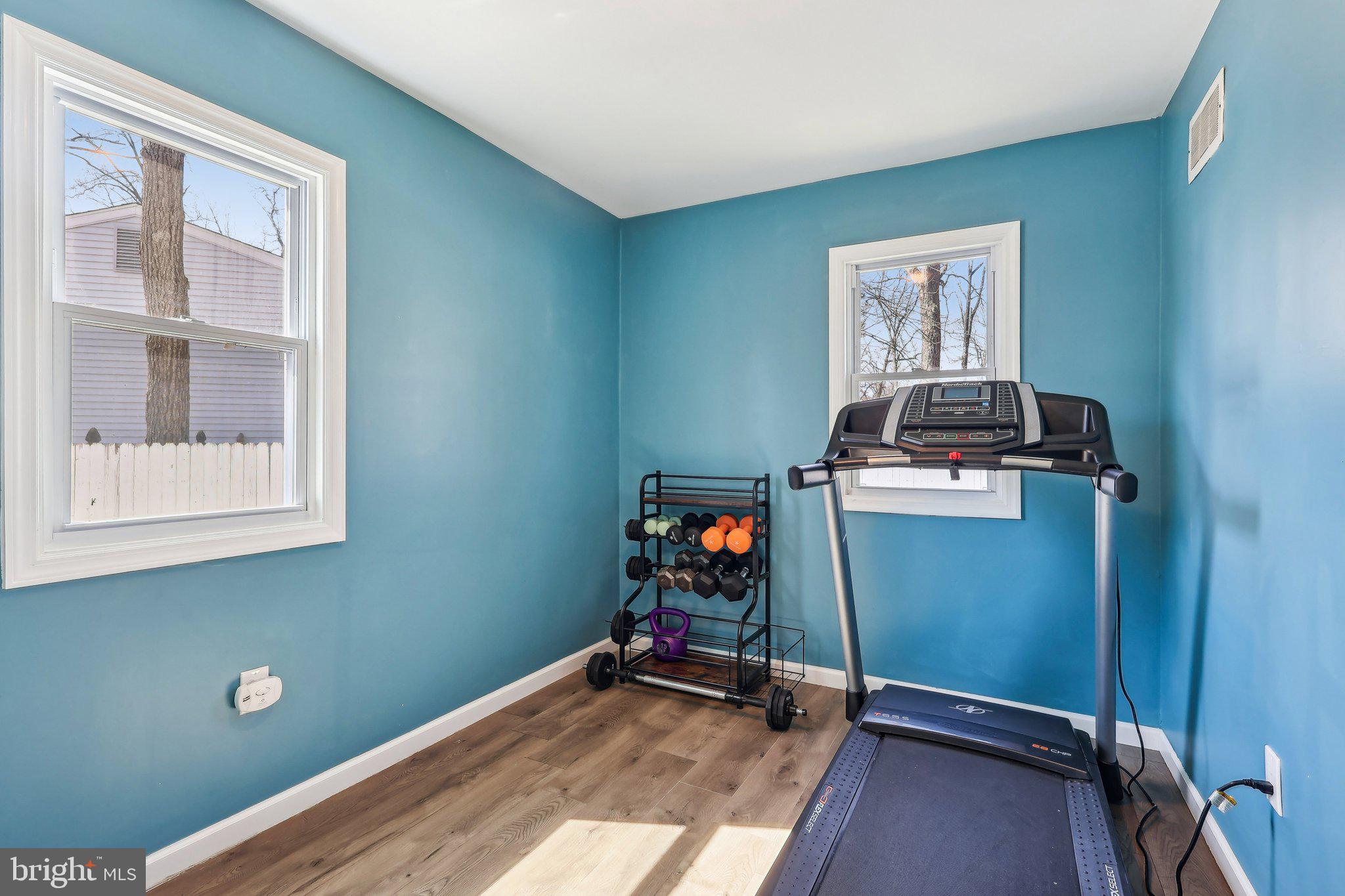 96 East 9th Avenue Pine Hill, NJ 08021 - Photo 18 of 31 a room with gym equipment and a window