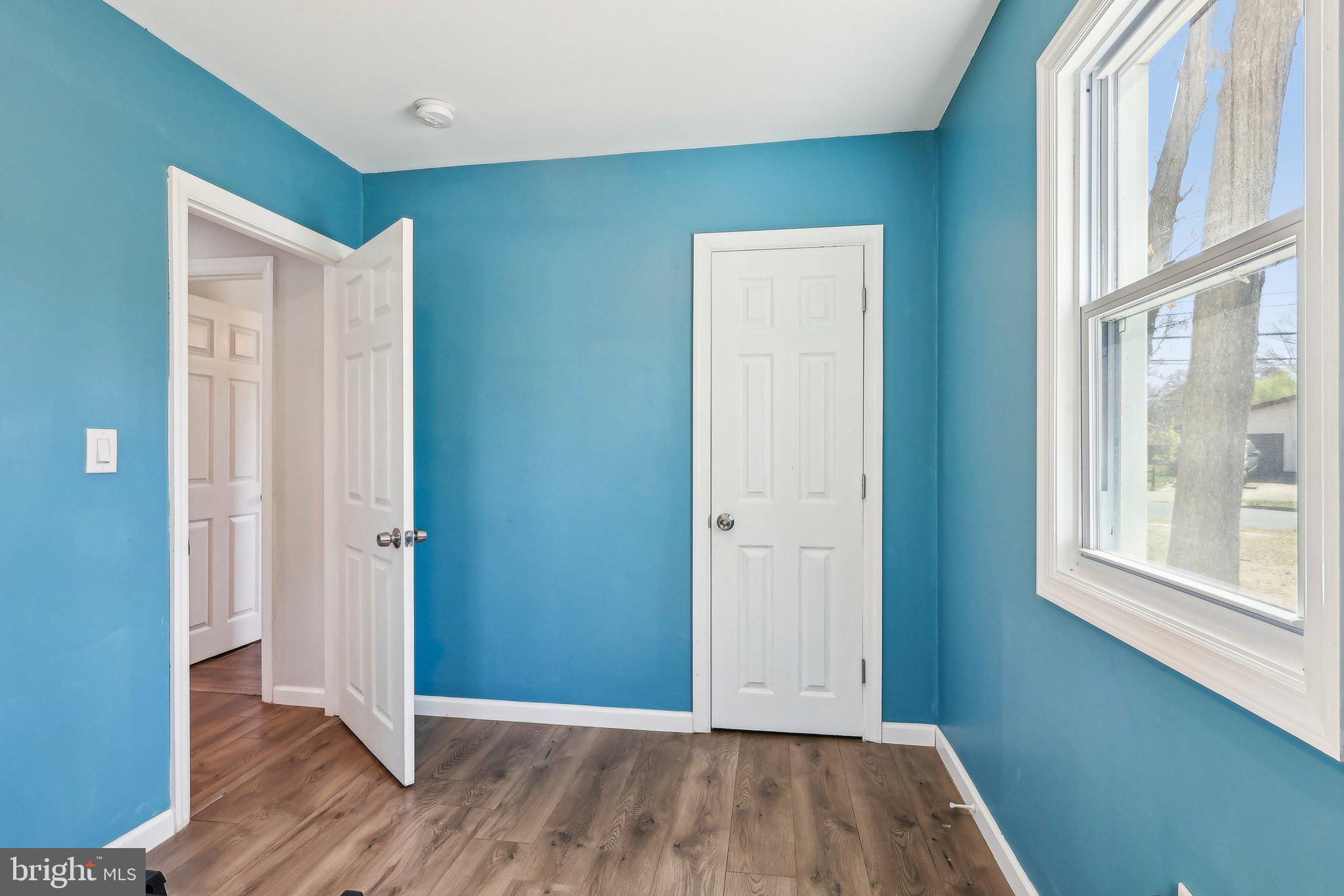 96 East 9th Avenue Pine Hill, NJ 08021 - Photo 19 of 31 an empty room with wooden floor and windows